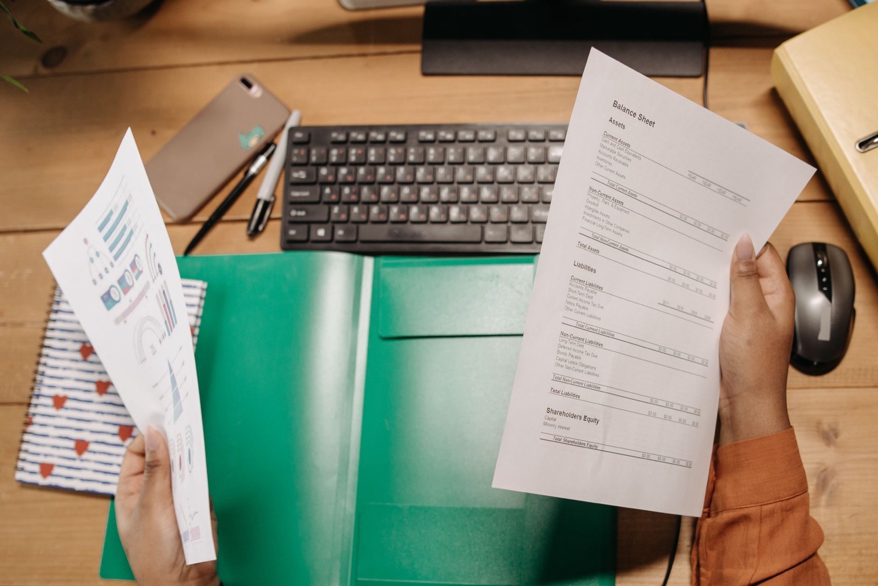A business owner reviewing financial documents at a desk