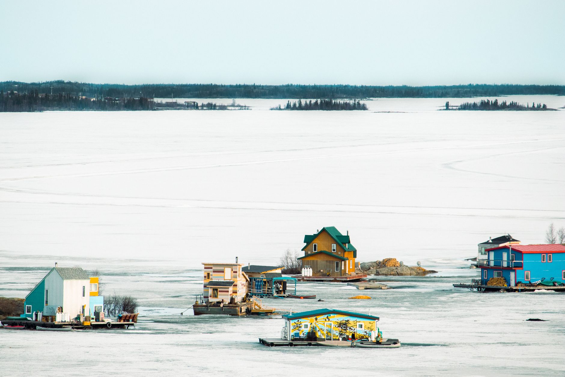 Houseboats near Yellowknife in a Northwest Territories winter landscape