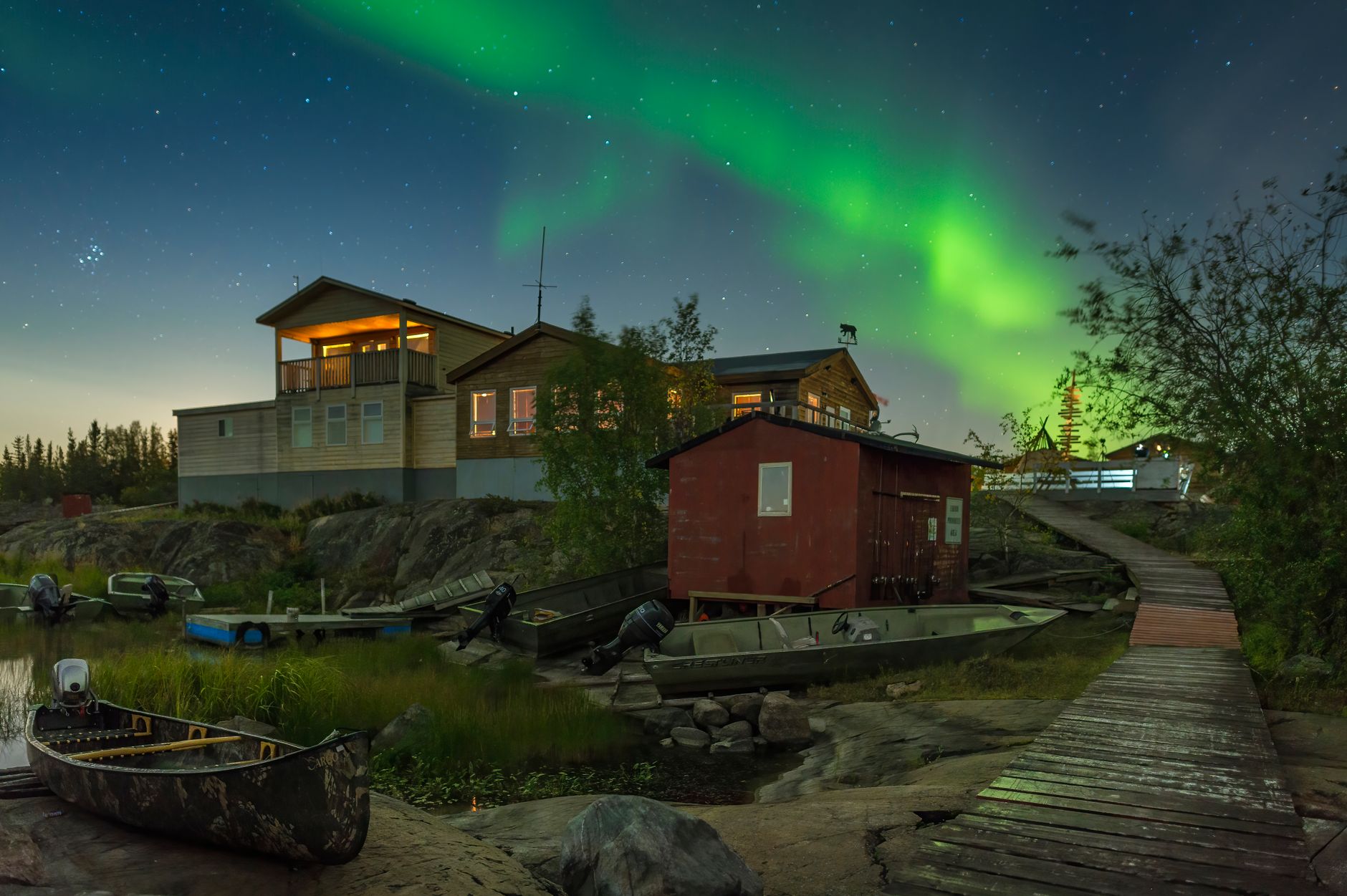 Aurora borealis above houses near Yellowknife